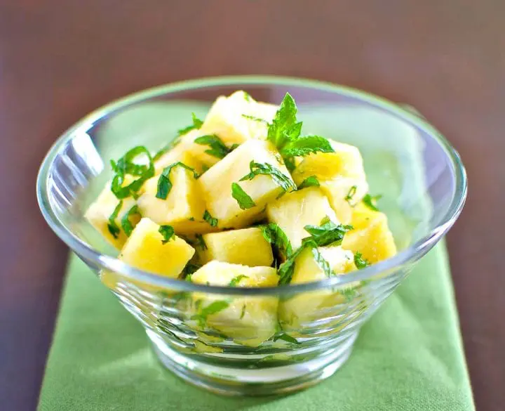 Pineapple salad in glass dish.