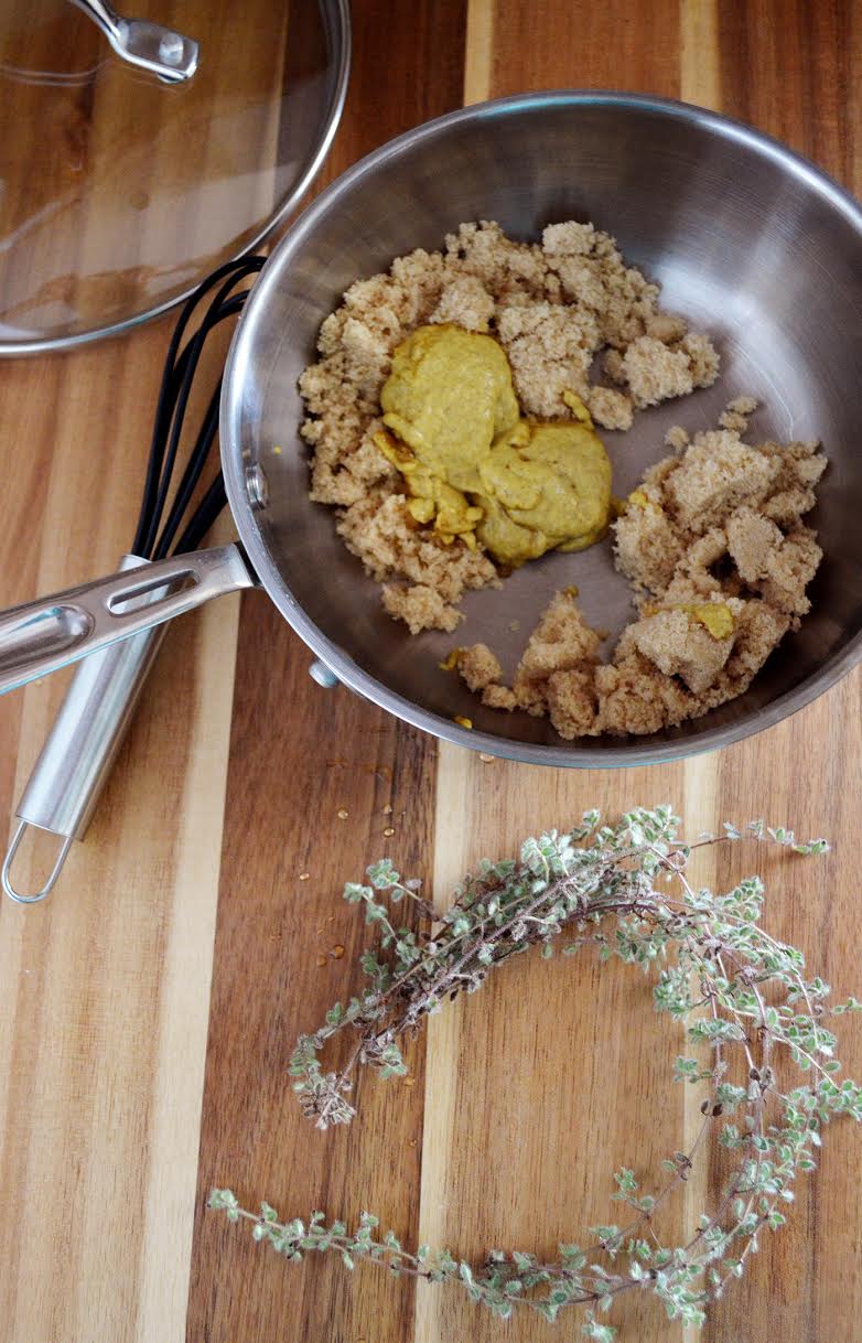 Brown sugar, mustard, and spices in a pan. 
