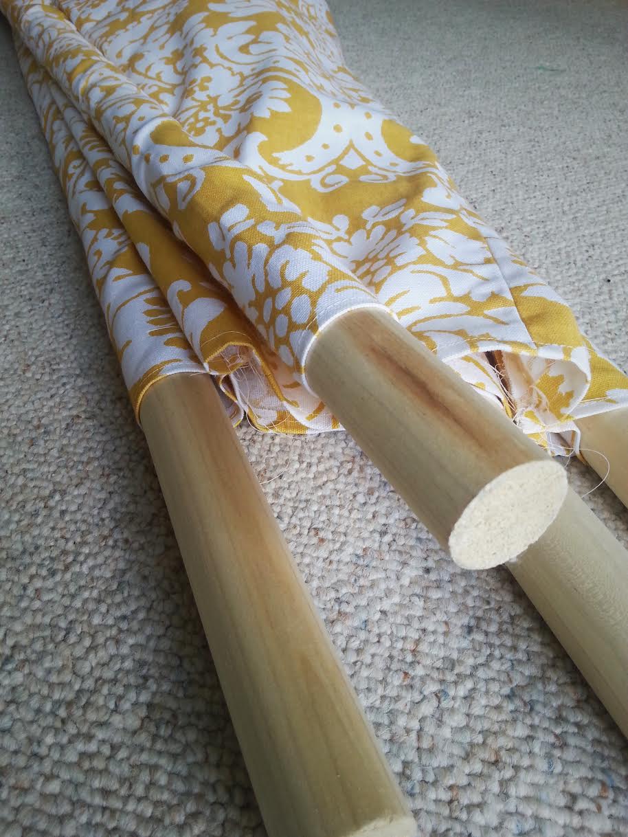 All four dowels inserted into their fabric sleeves.