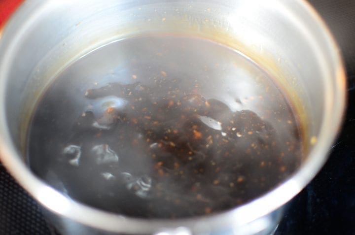 sticky marinade simmering on stove 