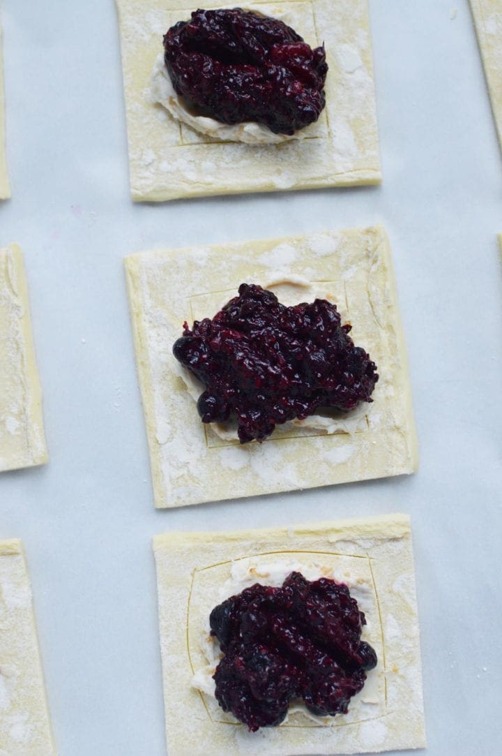 berry mixture on dough squares