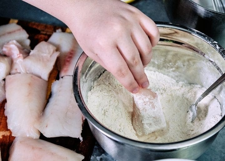 Sourdough Tempura Fried Pacific Cod - Flouring the fish and onion