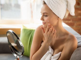 Beauty Day Woman doing her daily skincare routine at home