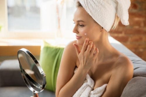 Beauty Day Woman doing her daily skincare routine at home