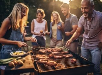 Candid family and friends outdoors, summer barbecue in backyard, enjoying food, laughter, and togetherness, generative ai