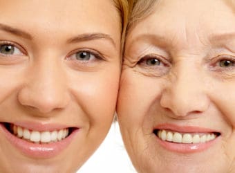 Close up of two faces of beautiful woman and mother