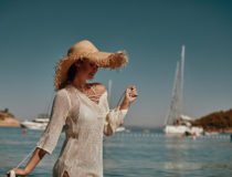 Girl in a swimsuit on the beach, the Adriatic coast, the mountai