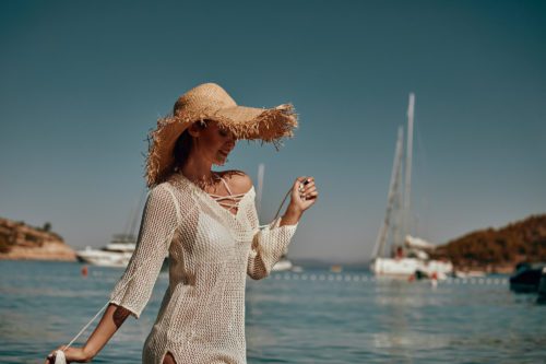 Girl in a swimsuit on the beach, the Adriatic coast, the mountai