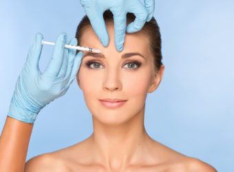 Beauty woman giving botox injections
